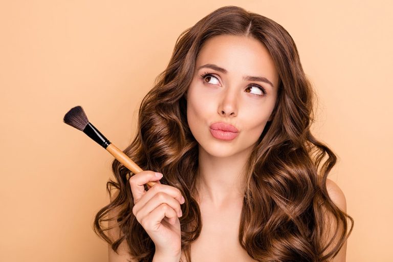 Close up photo of uncertain unsure girl hesitate hold blush blusher
