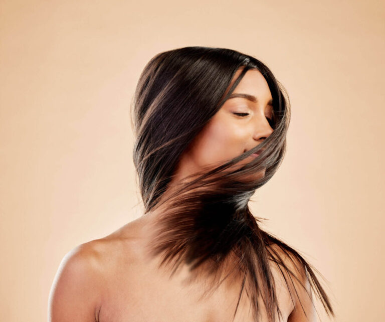 a woman with long hair covering her face