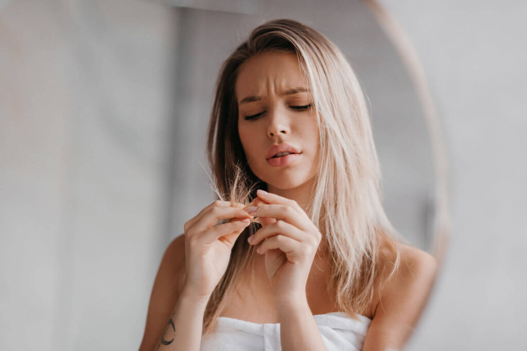 Beauty Blog confused woman pondering hair masks vs deep conditioner