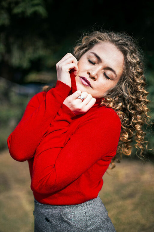 Beauty Blog Woman Wearing a Red Long sleeved Top