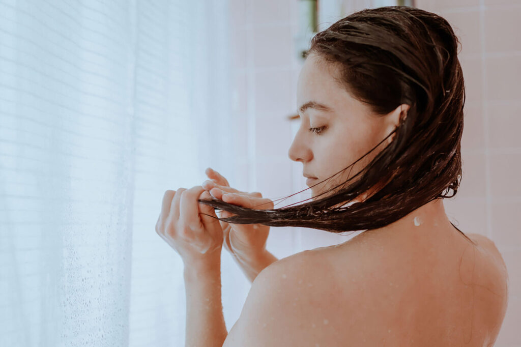 Beauty Blog Woman washing her hair at home stock photo