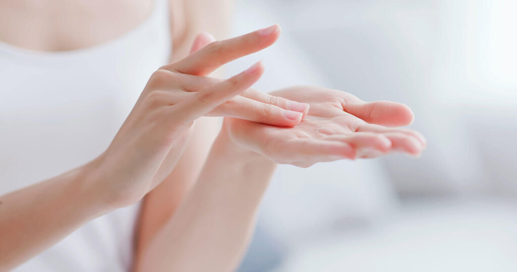 Beauty Blog woman apply moisturizer in hand