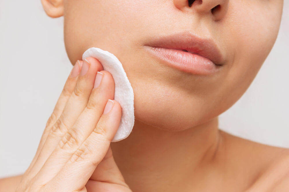 Beauty Blog Cropped shot of a young woman cleaning her face with cotton pad