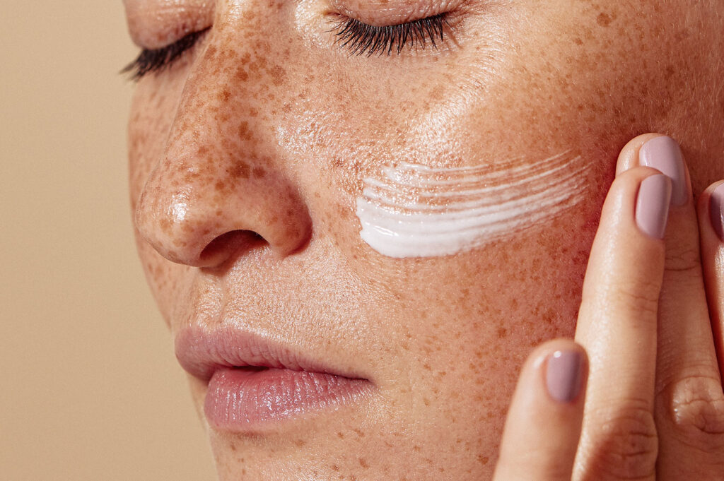 Beauty Blog Close-up of female face with freckled skin stock photo