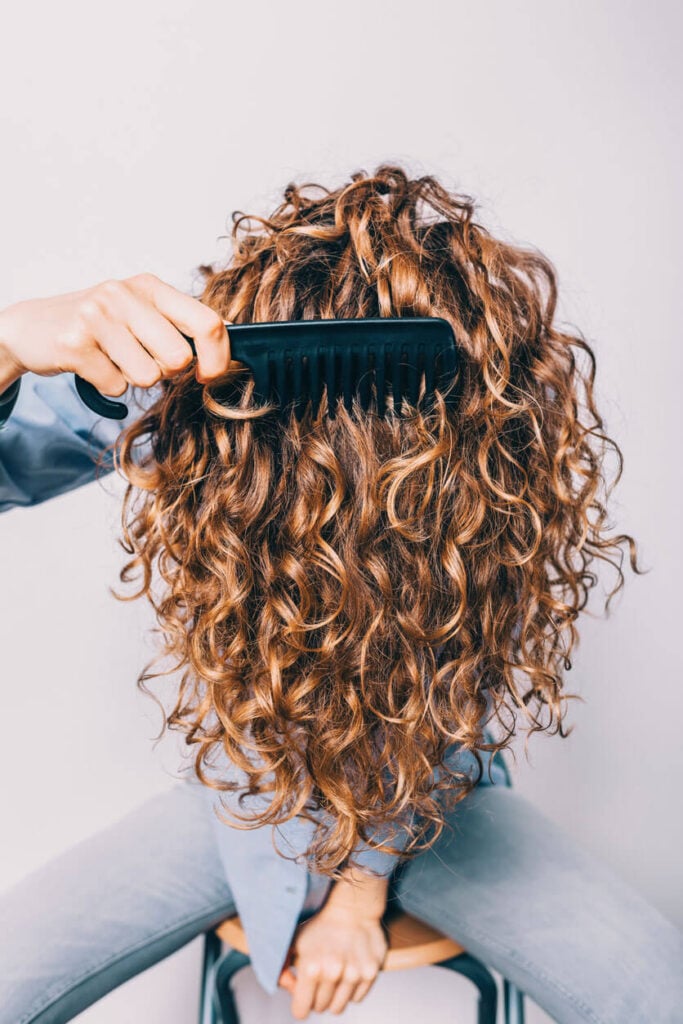 Beauty Blog Close-up of female head with thick long curly hair