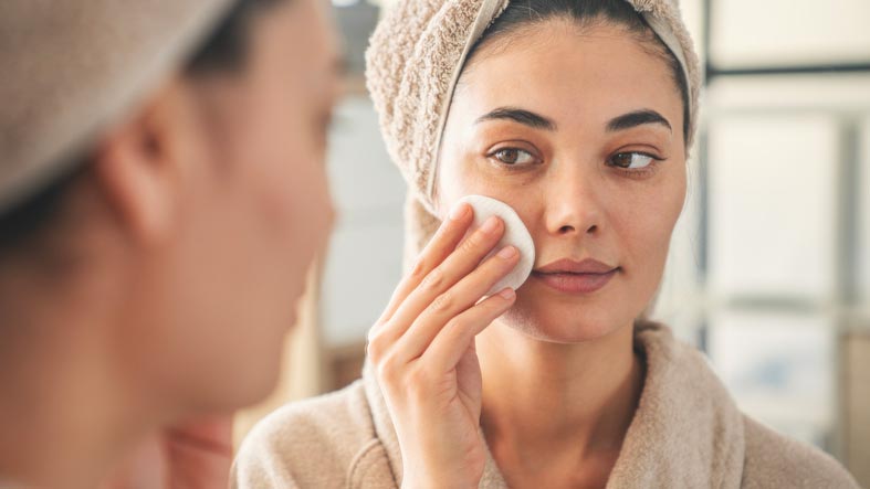Beauty Blog Daily facial care in the mirror stock photo