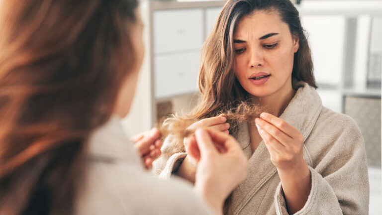 Young woman with hair problems stock photo