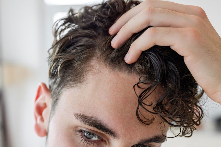Beauty Blog Male checking his hair stock photo